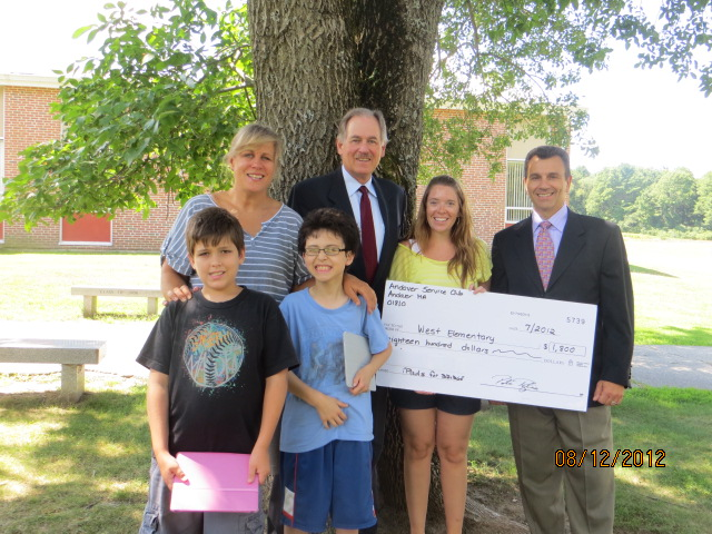 Pictured from left are, back row: Principal Elizabeth Roos, Andover Service Club member John Roberts, BRIDGES teacher Erin Throwe and Service Club member Peter Paglia; front row student iPad users C.J. Chapman and William Bernardin.